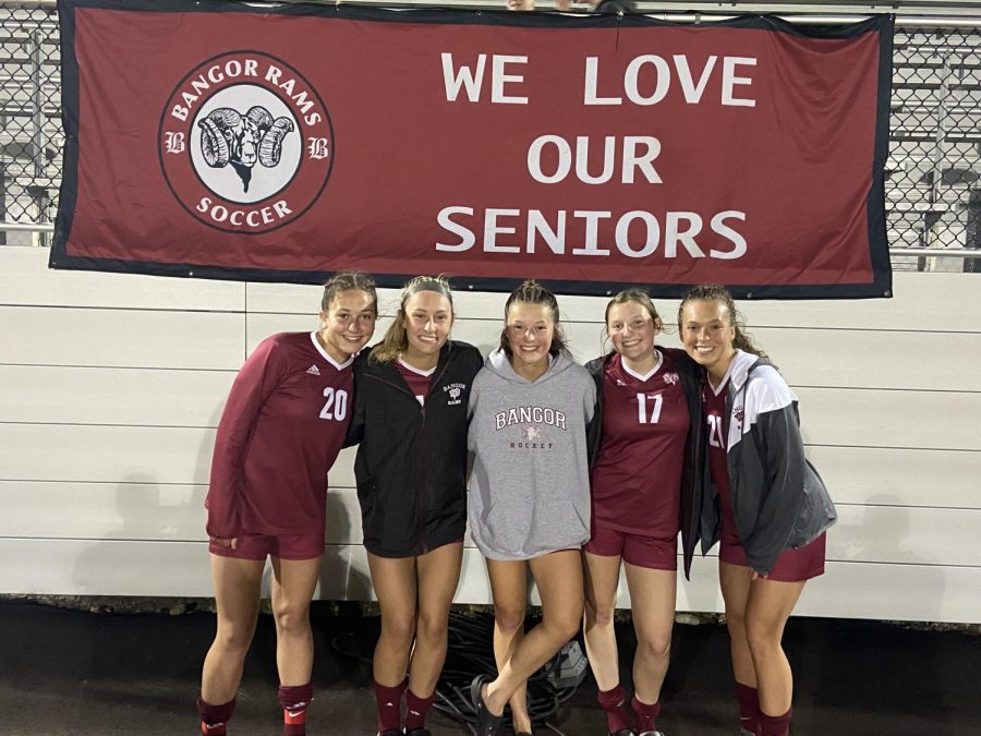 Senior girls pose on Senior night. The team would end the season undefeated.