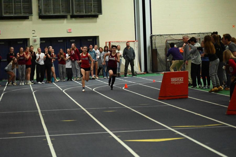 Carolina Fallona (Scarborough) and Madeline Thai (Bangor) on the final stretch of the 4x200m relay.